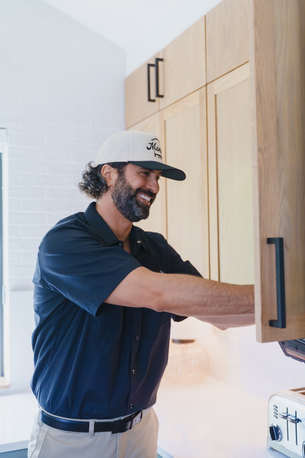 Monty's team member smiling while working in a kitchen